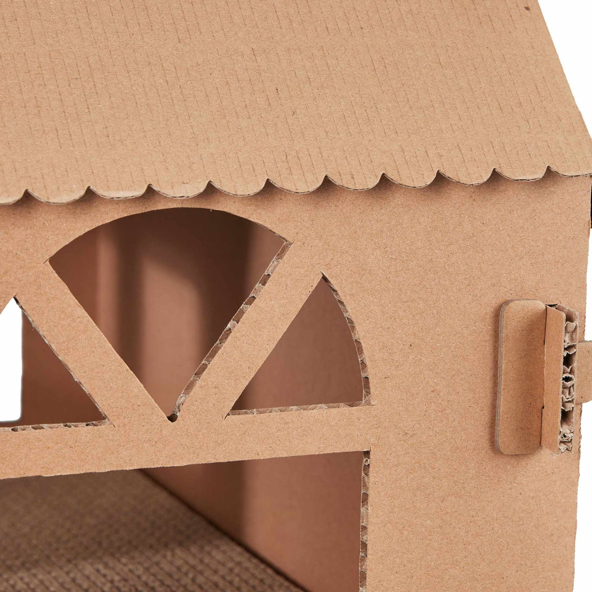 Cardboard cat house with scratching board