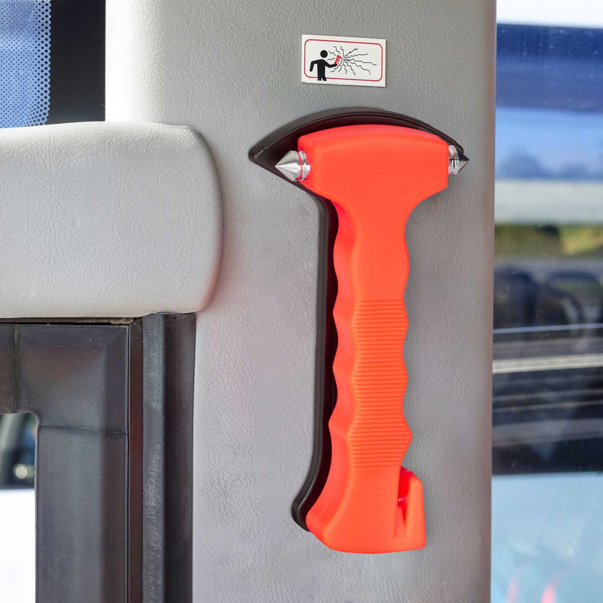 Car with emergency hammer and seat belt cutter