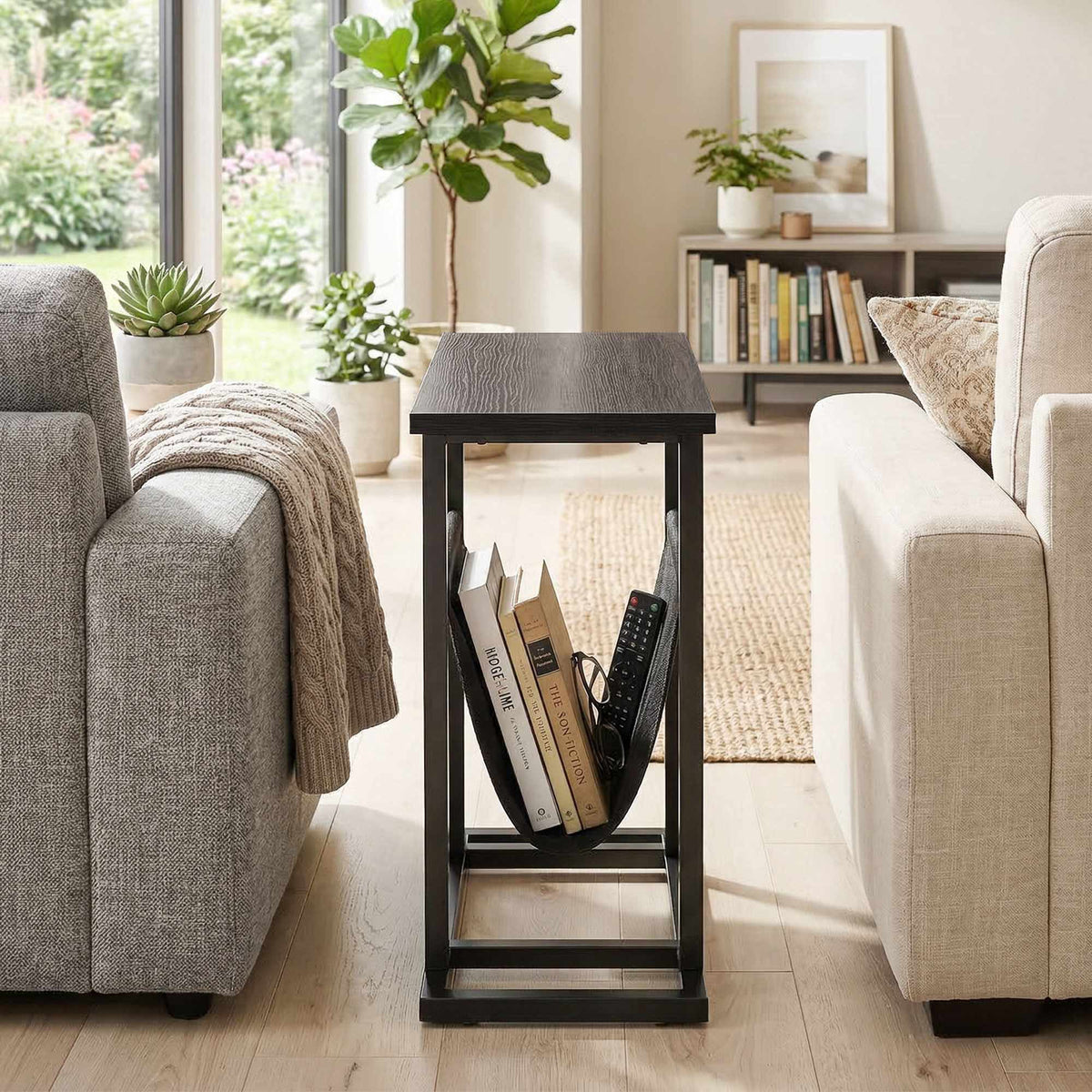 Compact Black Side Table with Steel Frame and Fabric Pocket