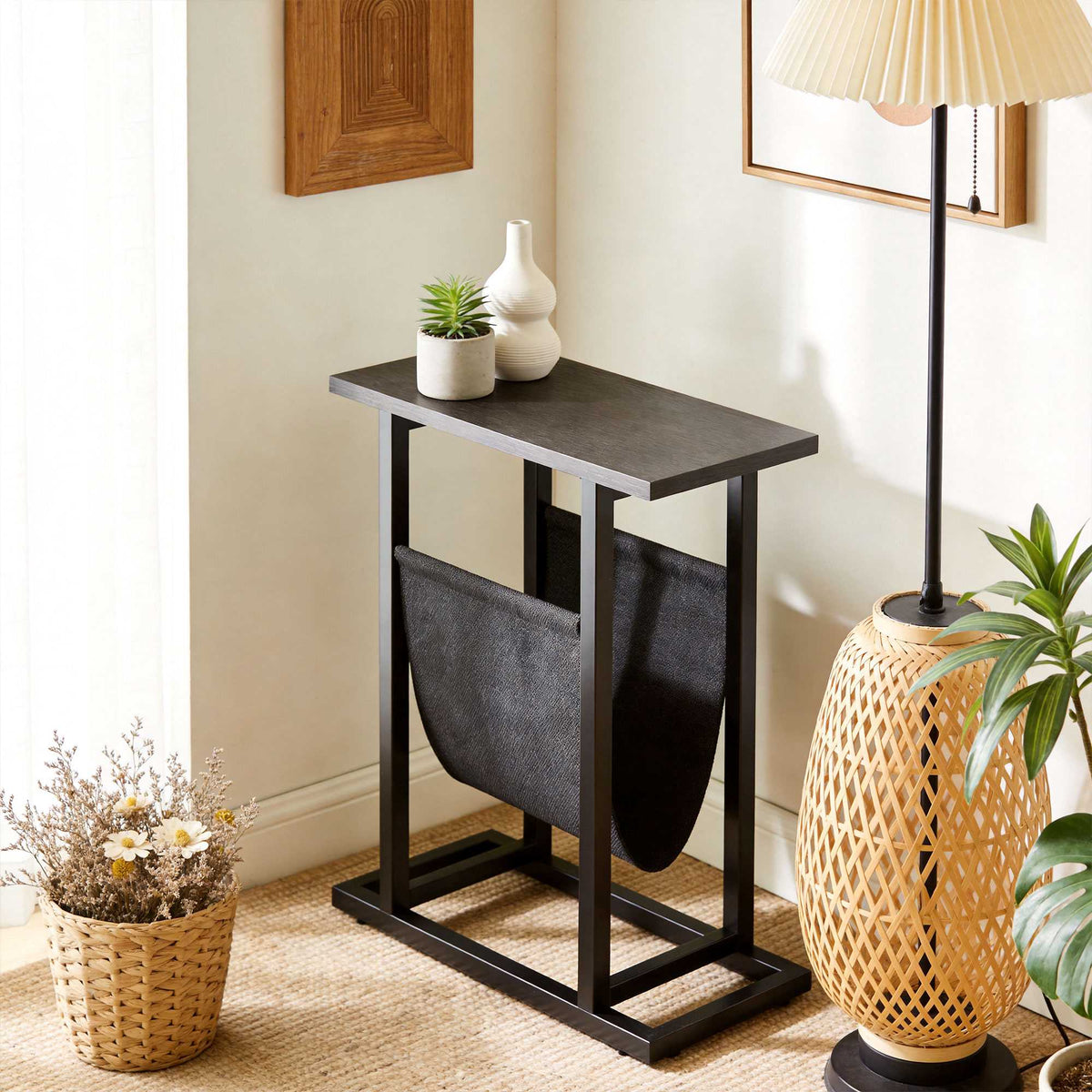 Compact Black Side Table with Steel Frame and Fabric Pocket
