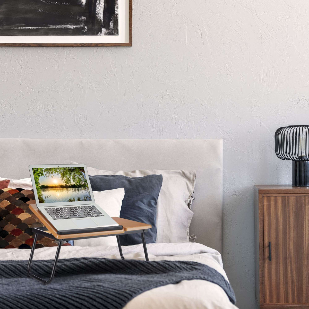 Laptop table with tiltable work surface