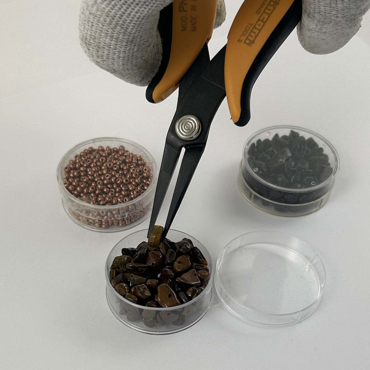 Needle nose pliers with long, smooth jaws rounded on the outside