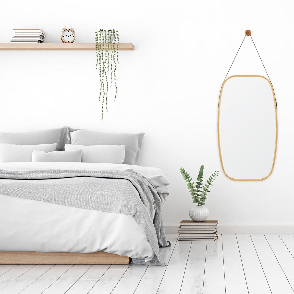 Oval wall mirror with strap