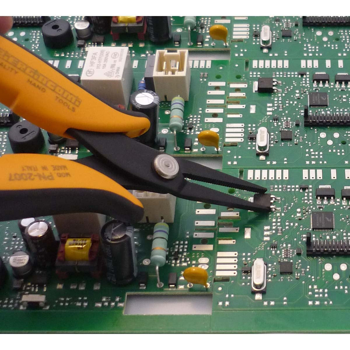 Pliers with long serrated jaws