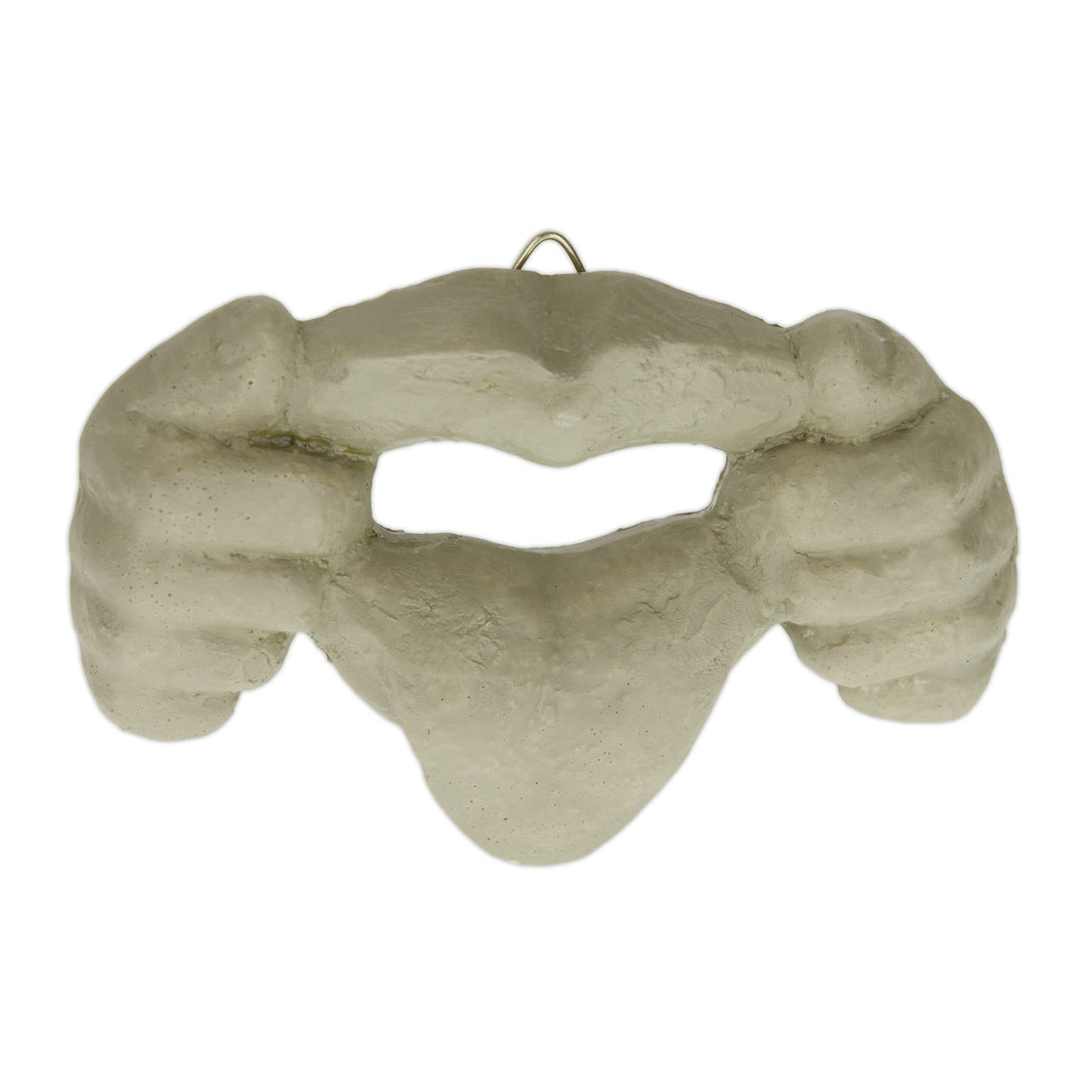 Wooden face with protruding tongue