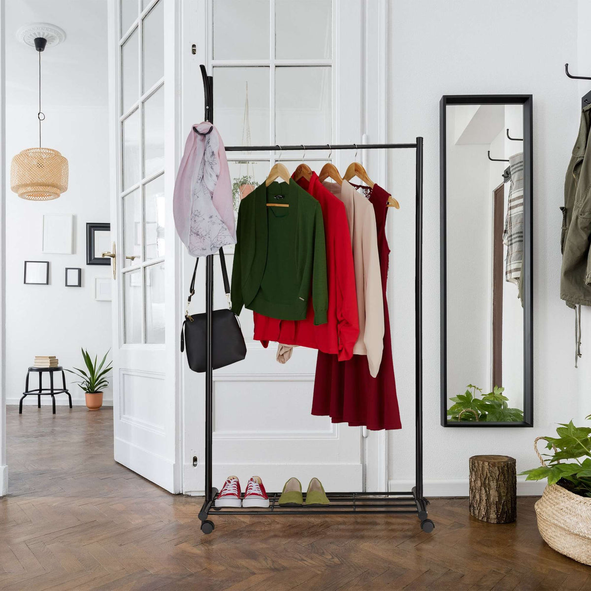 Black coat hanger with wheels