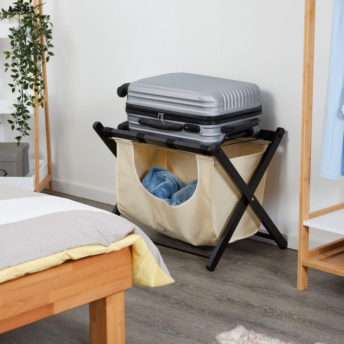Black suitcase rack with laundry bag