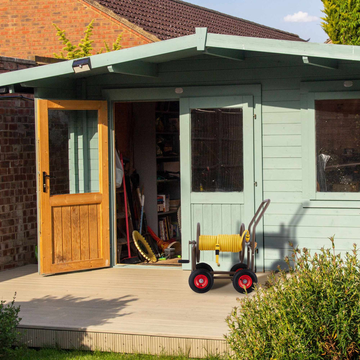 Brown hose cart with 4 wheels