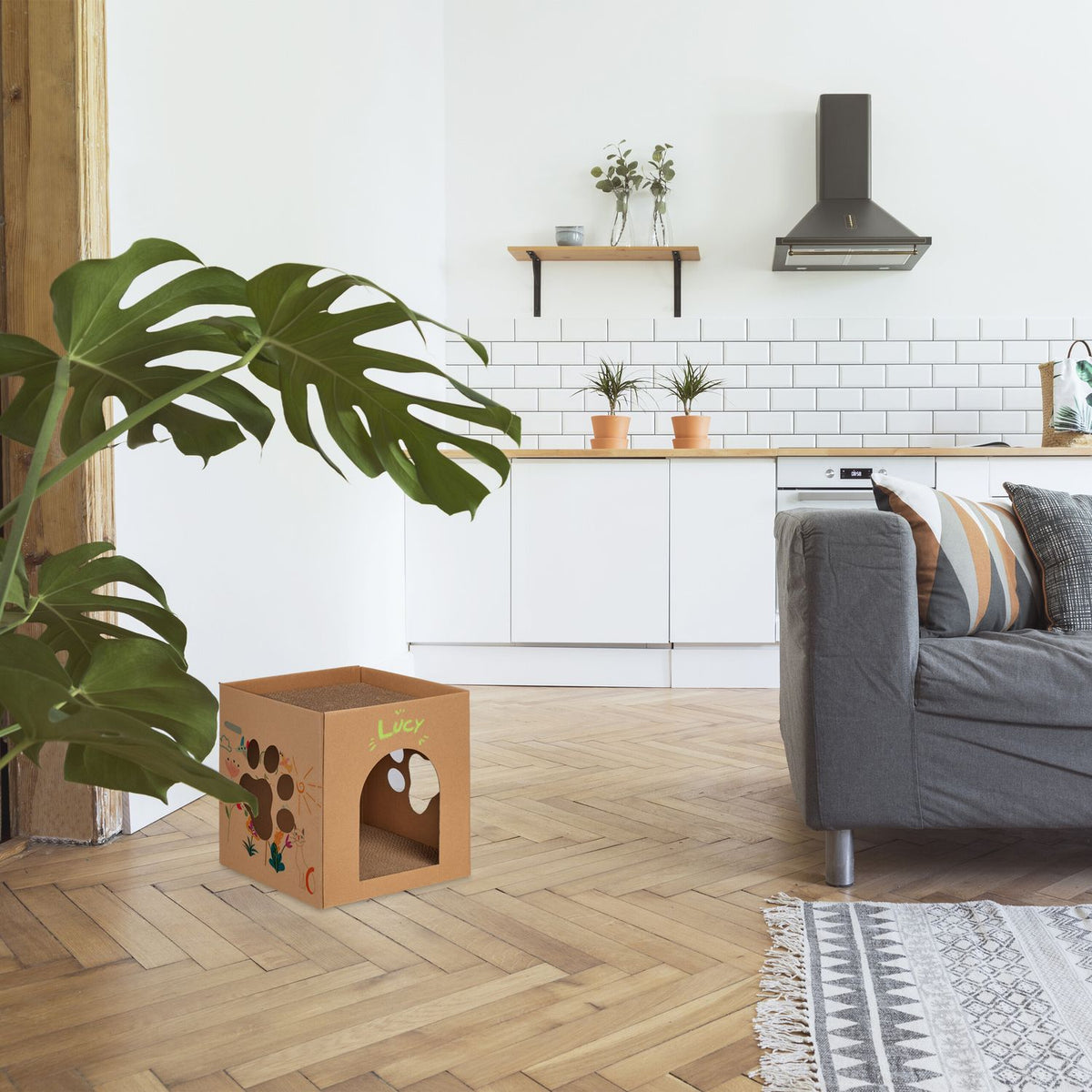 Cardboard cat house with scratching board