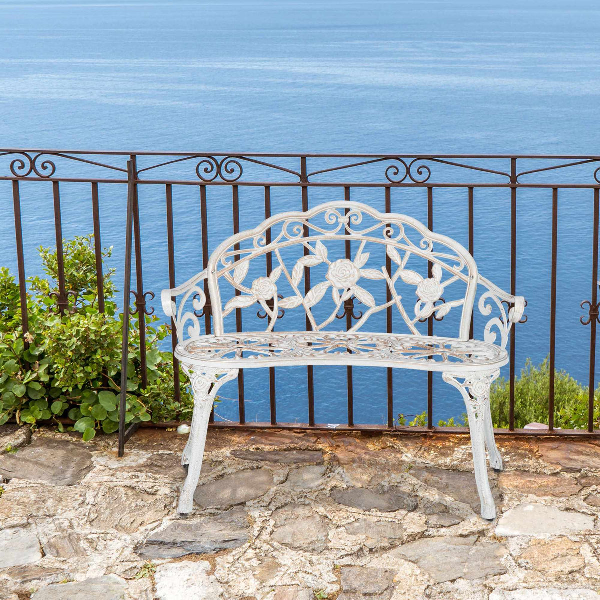 Garden bench white-bronze colored with roses
