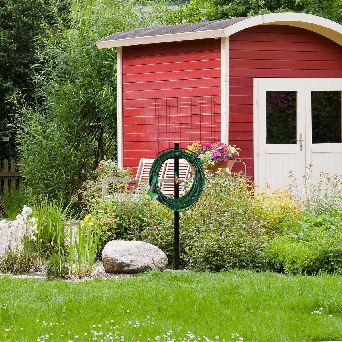 Garden faucet with hose holder