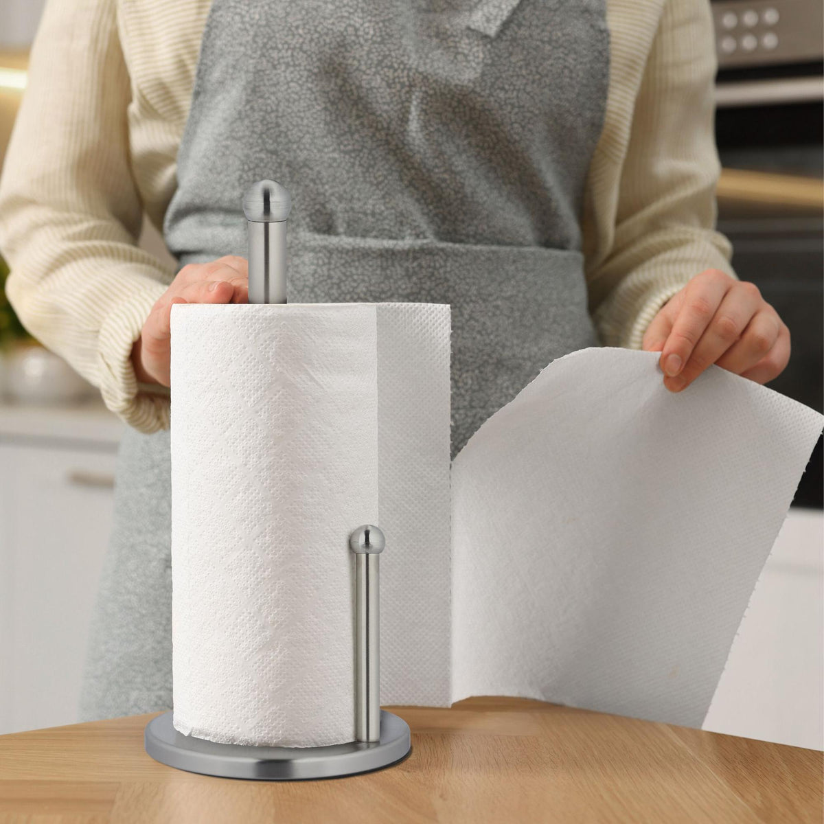 Holder for household paper in stainless steel
