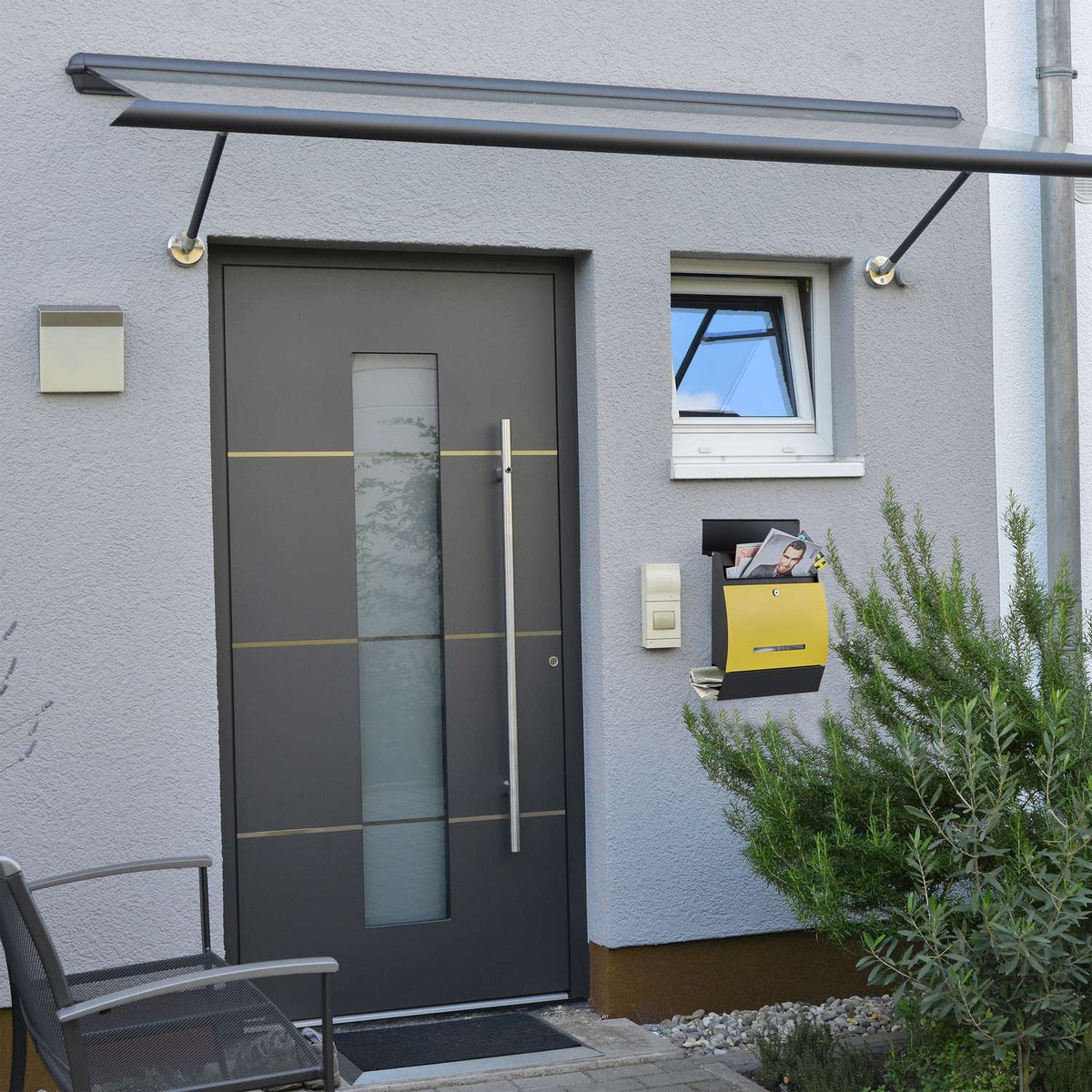 Letterbox with newspaper holder