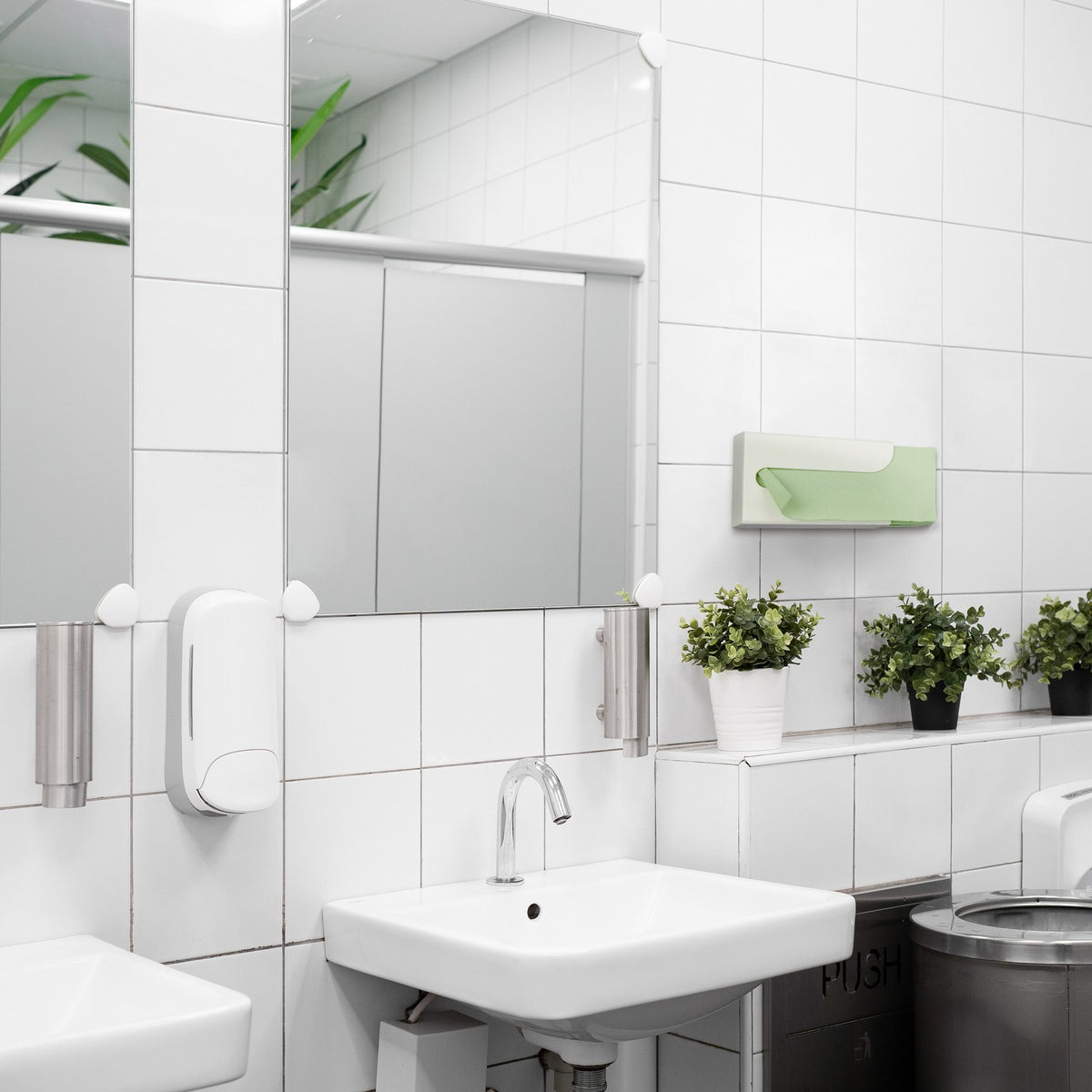 Paper dispenser for the wall in a set of 2
