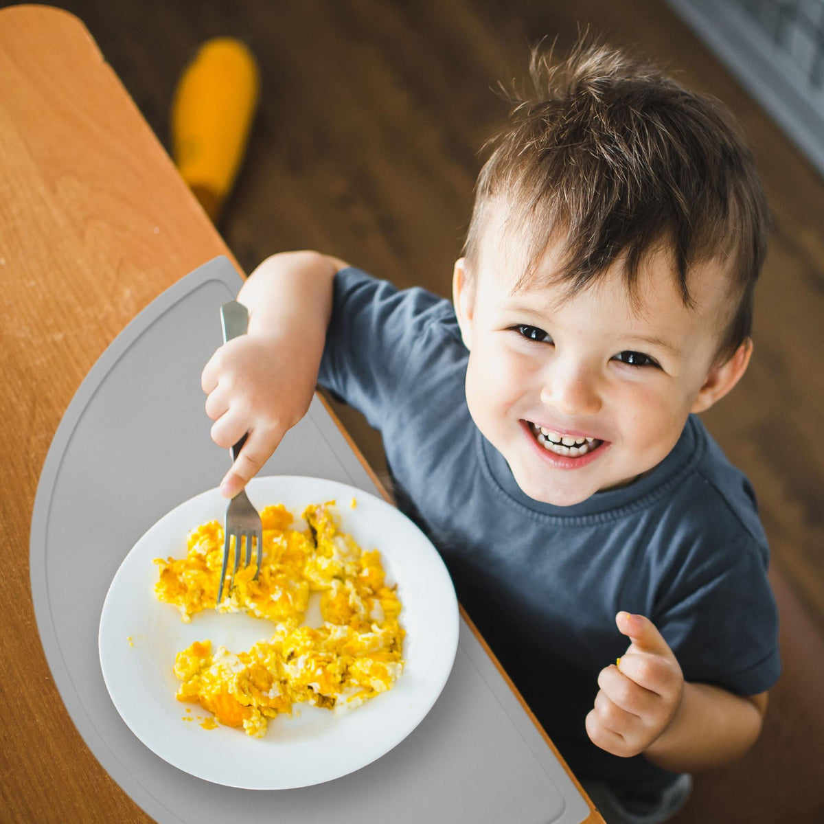 Placemat for children in a semi-circular shape
