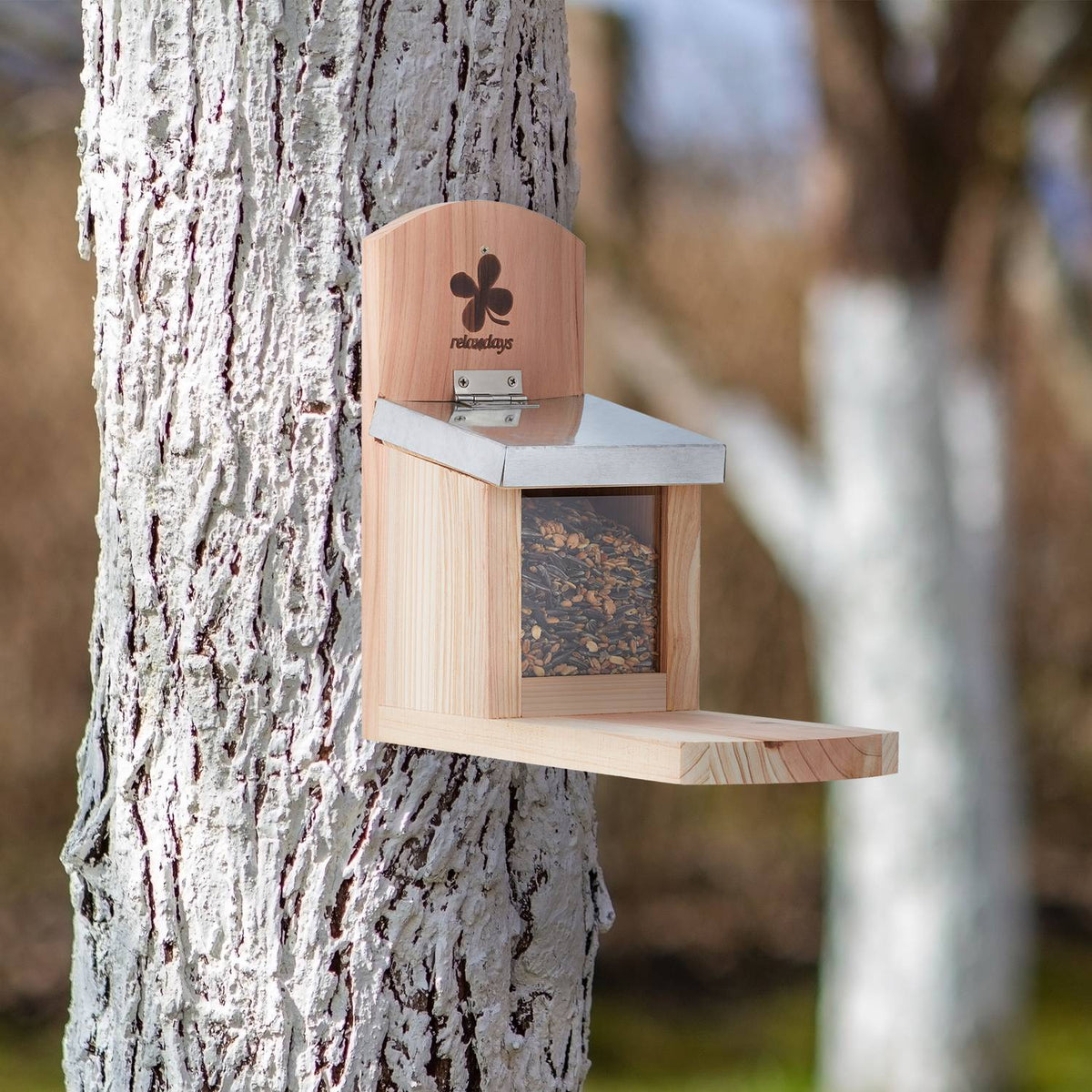 Squirrel feeder with metal roof
